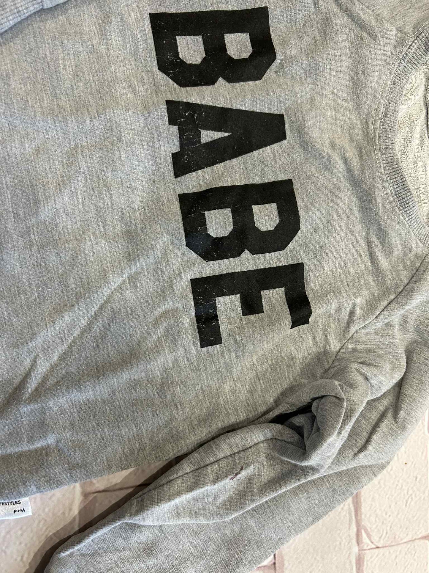 Tops Size 3/4 Cracking On Logo